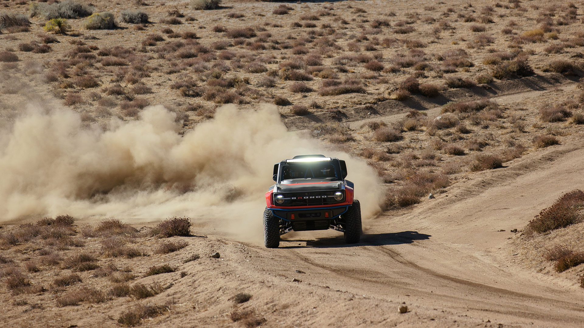 Bronco DR driving towards camera in the desert